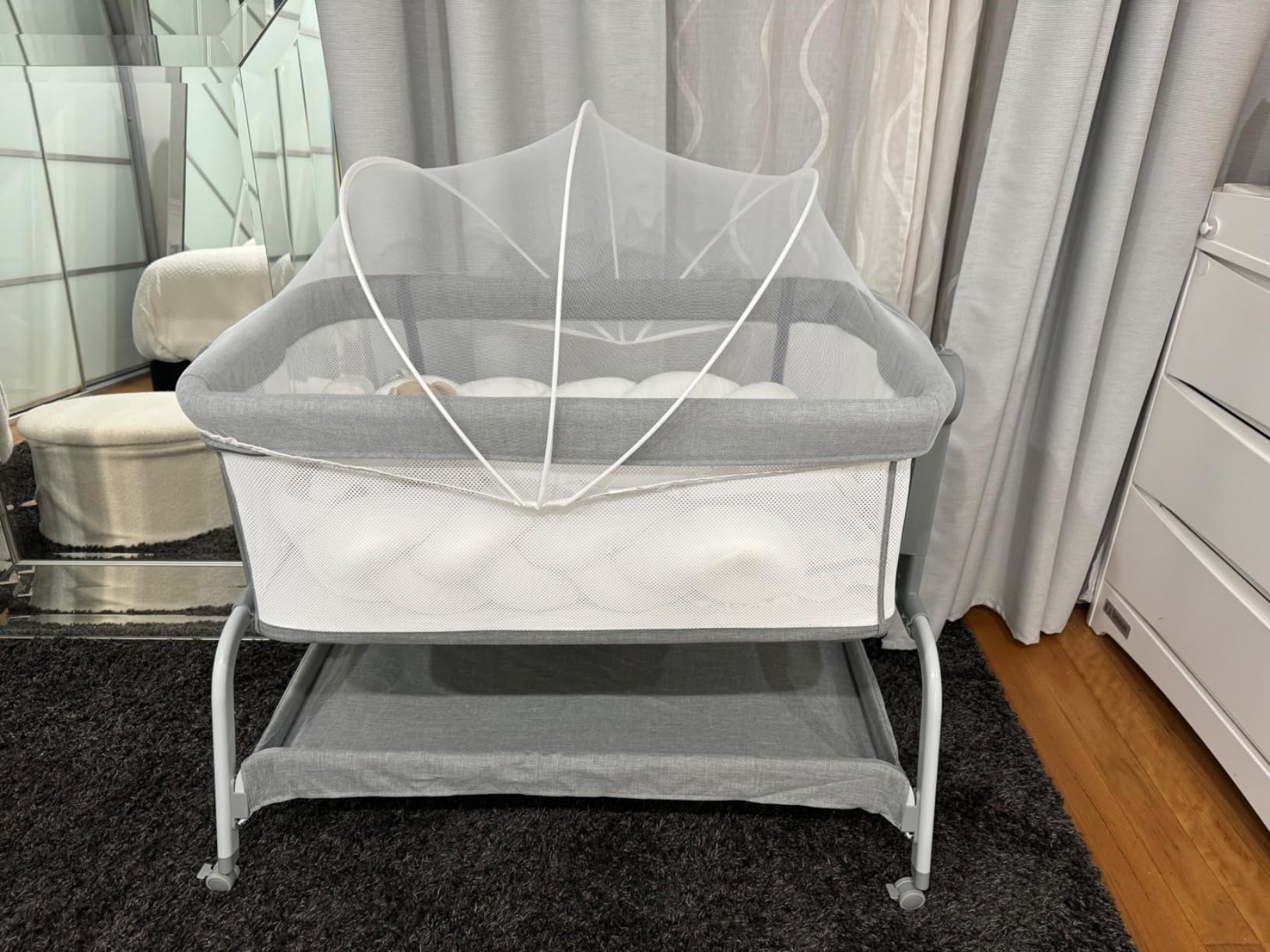 BABY JOY bassinet in use in a real home